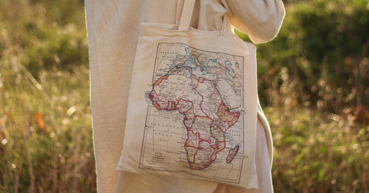 Close-up of a cotton tote bag with a printed map of Africa, promoting eco-friendly fashion.